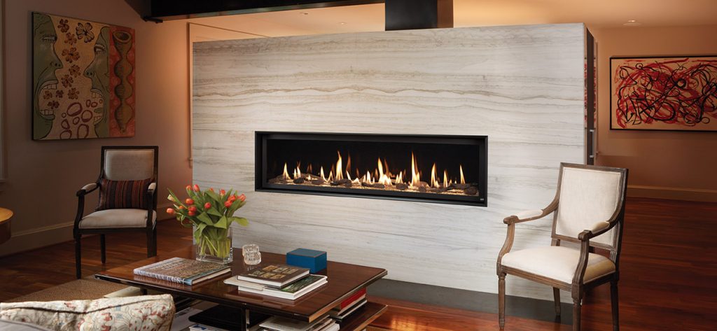 Fireplace Xtrordinair linear fireplace in a stone feature wall